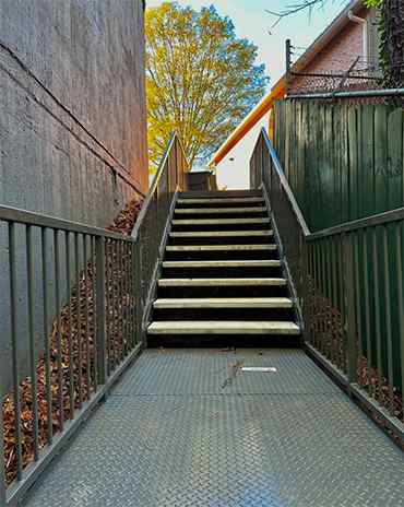 Luxurious metal staircase with custom design and precision craftsmanship for upscale interiors