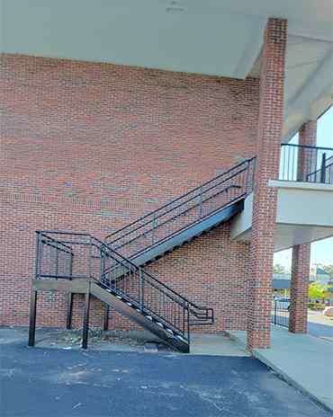 Floating metal staircase with glass railings for a modern interior design