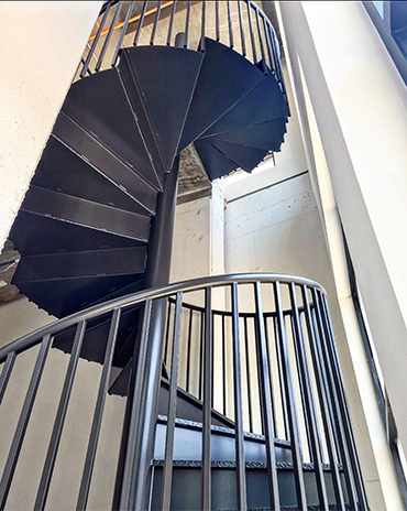 Stylish metal staircase featuring industrial design with a bold, robust structure